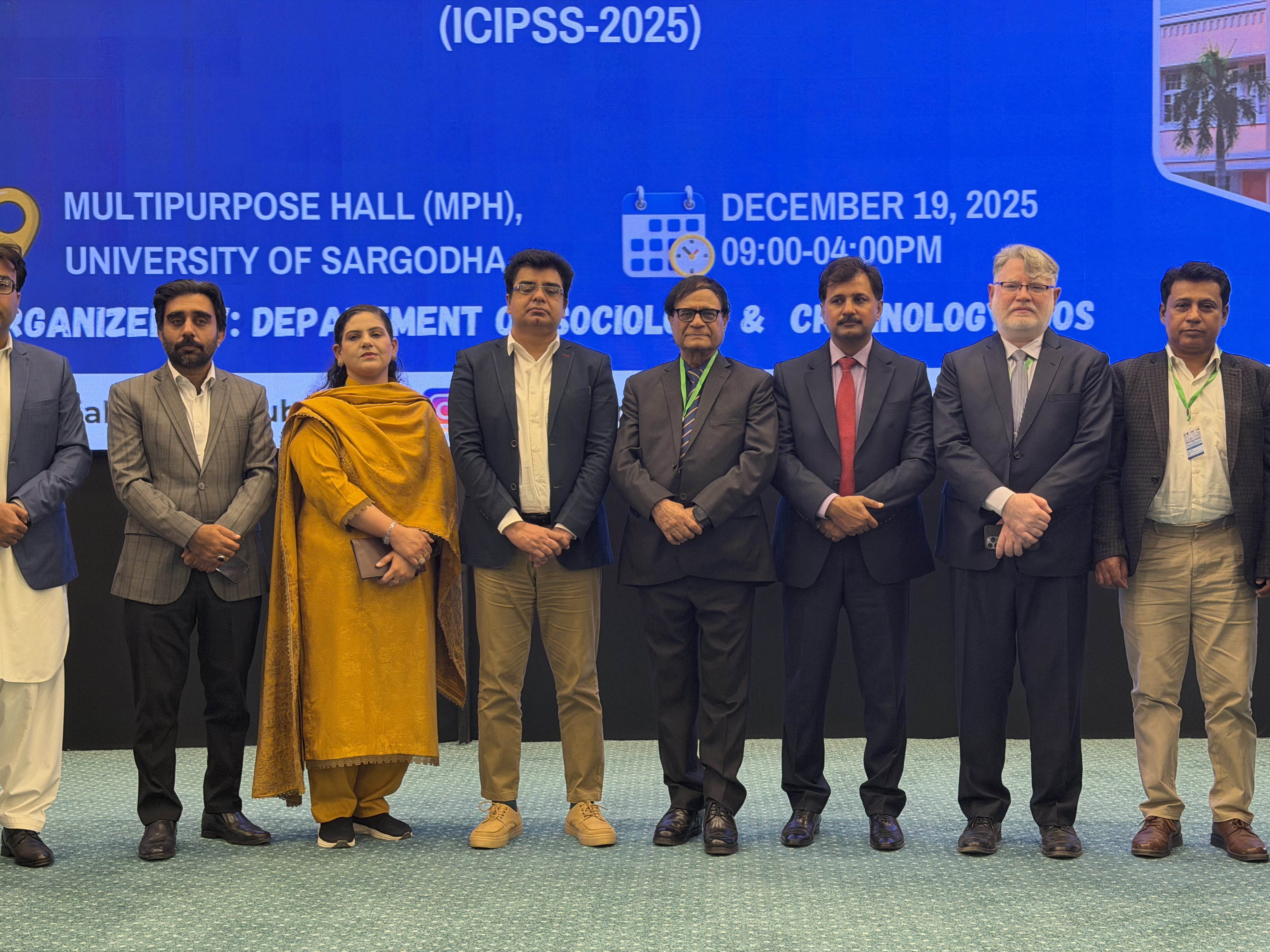 Dr. Hussain with other presenters in Pakistan.